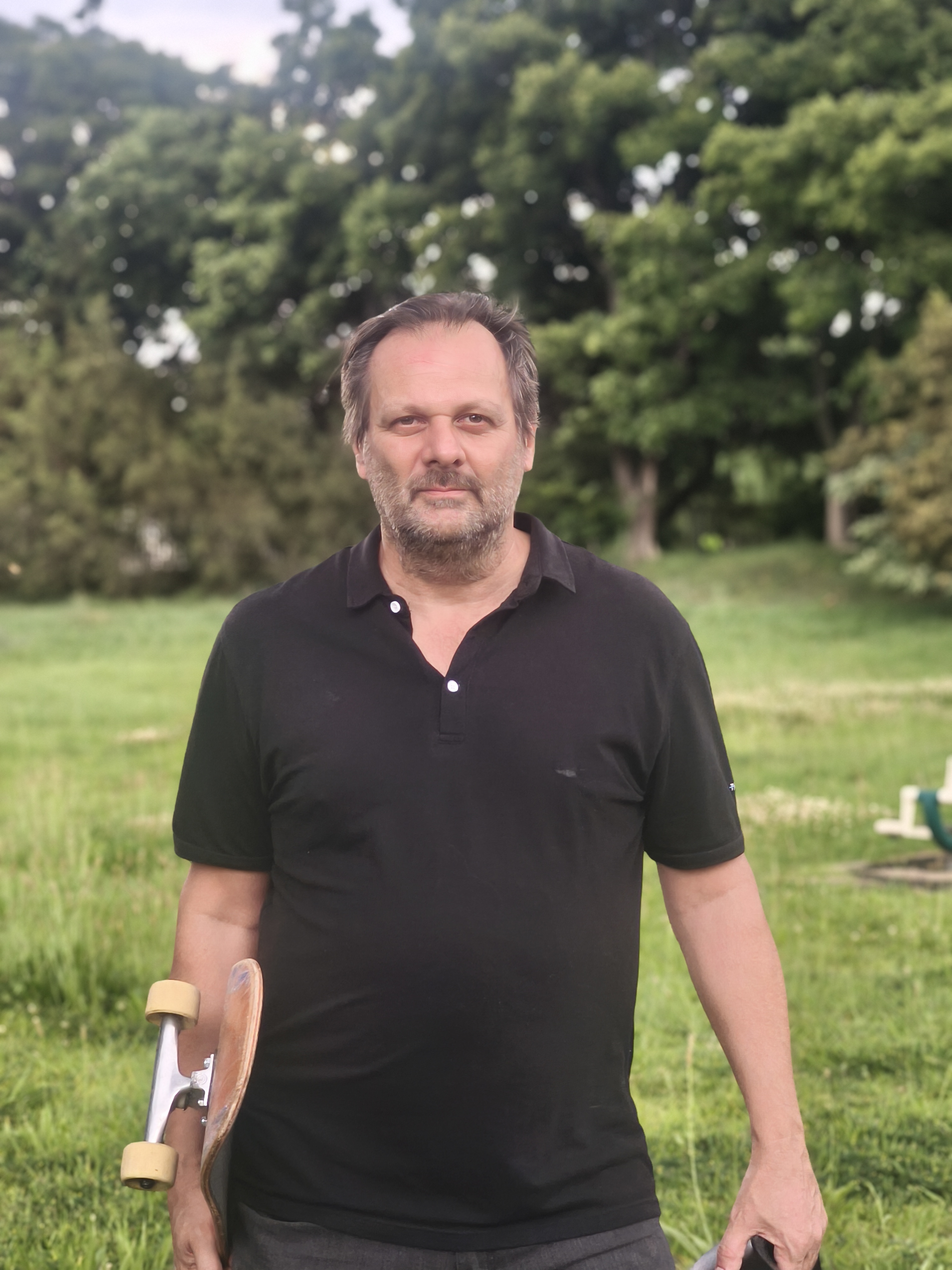 Founder Portrait holding skateboard
